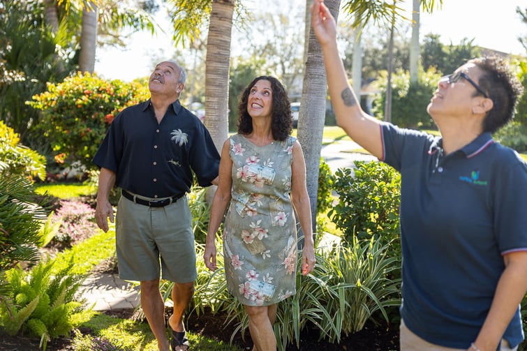 customer sales talking to client in backyard