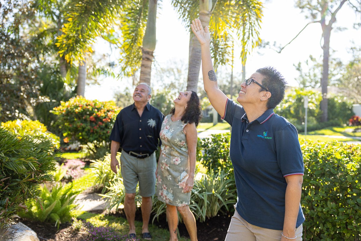 landscape design consultant showing homeowners design elements in yard