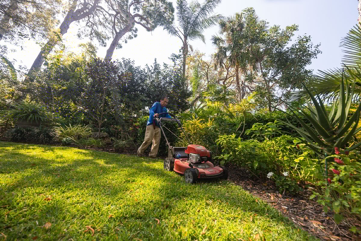 residential maintenance crew mowing