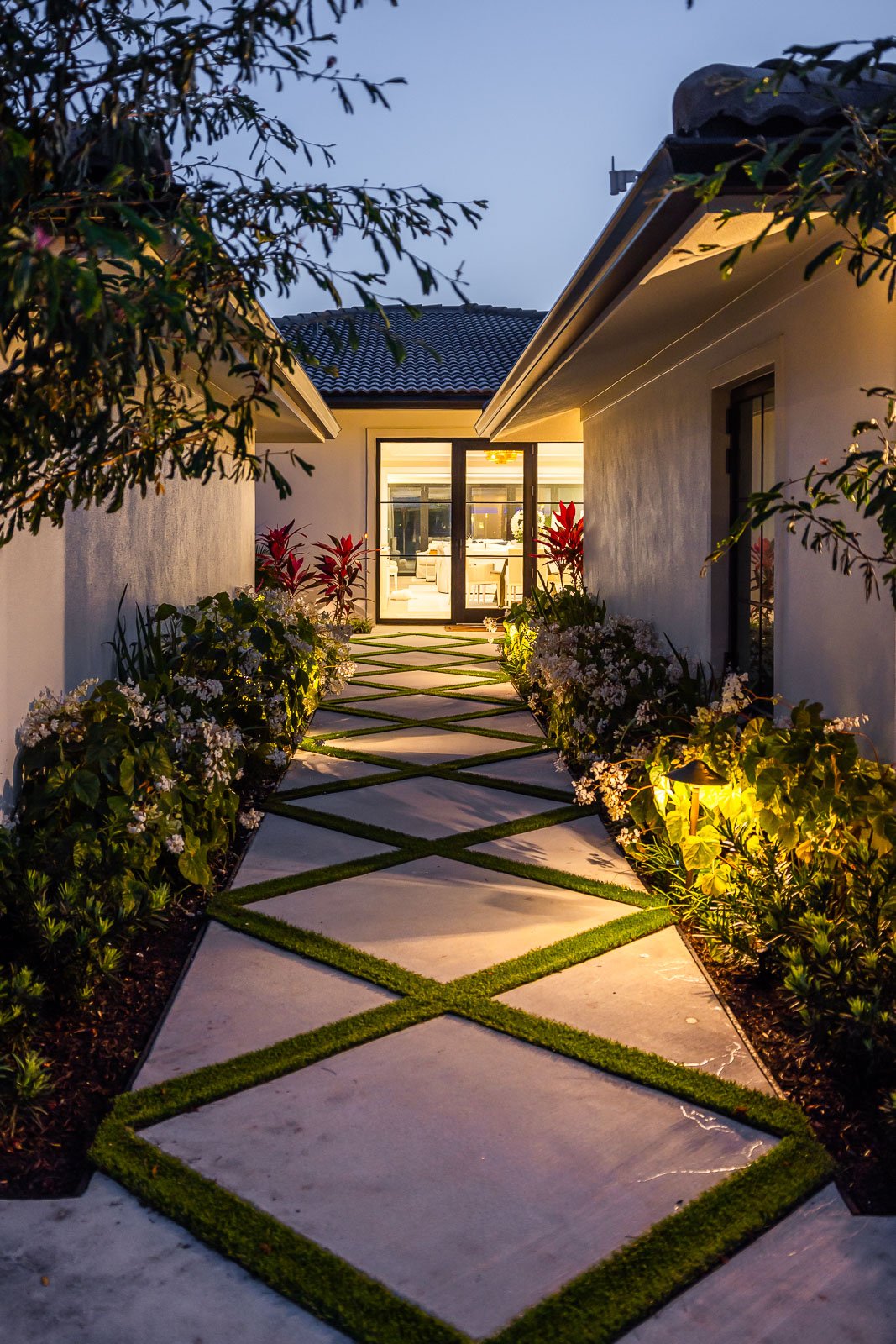 landscape lighting on house and in garden beds 2