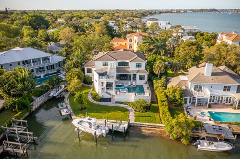 aerial view of backyard backed up to water 