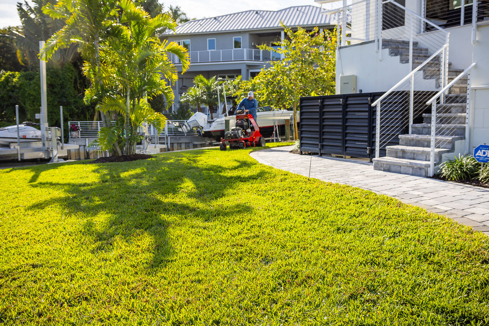 landscape maintenance crew aerating lawn