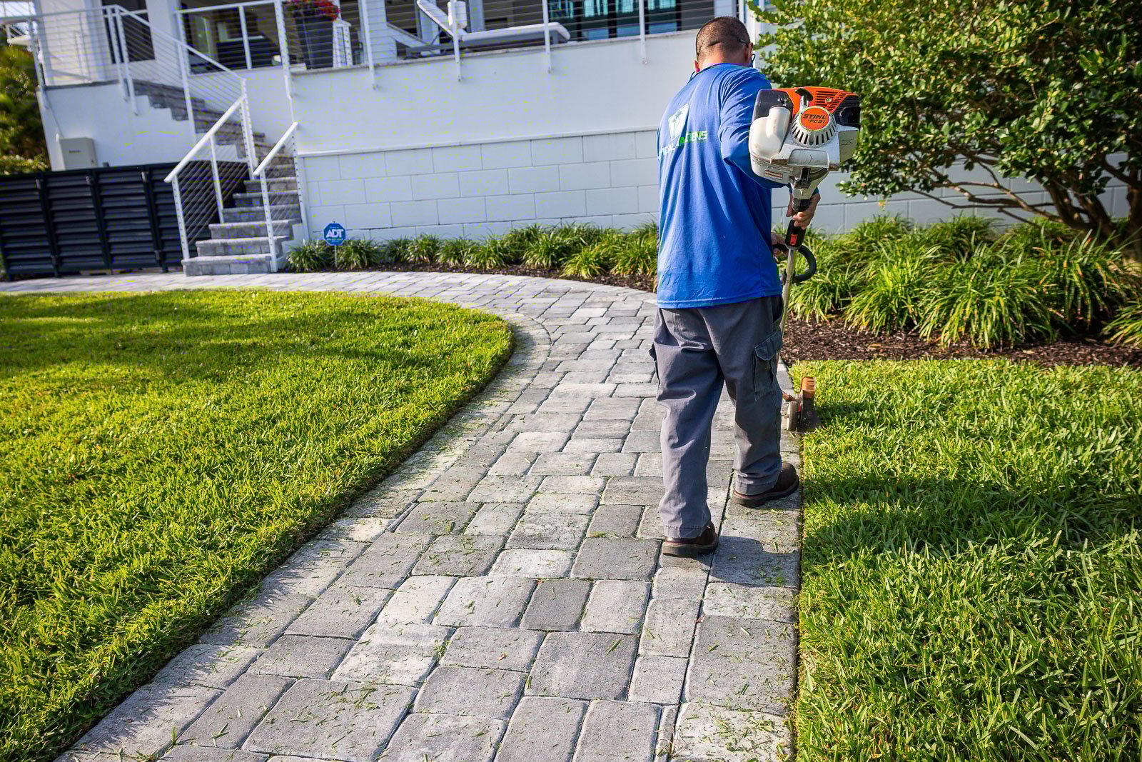 landscape maintenance crew edging in yard 1