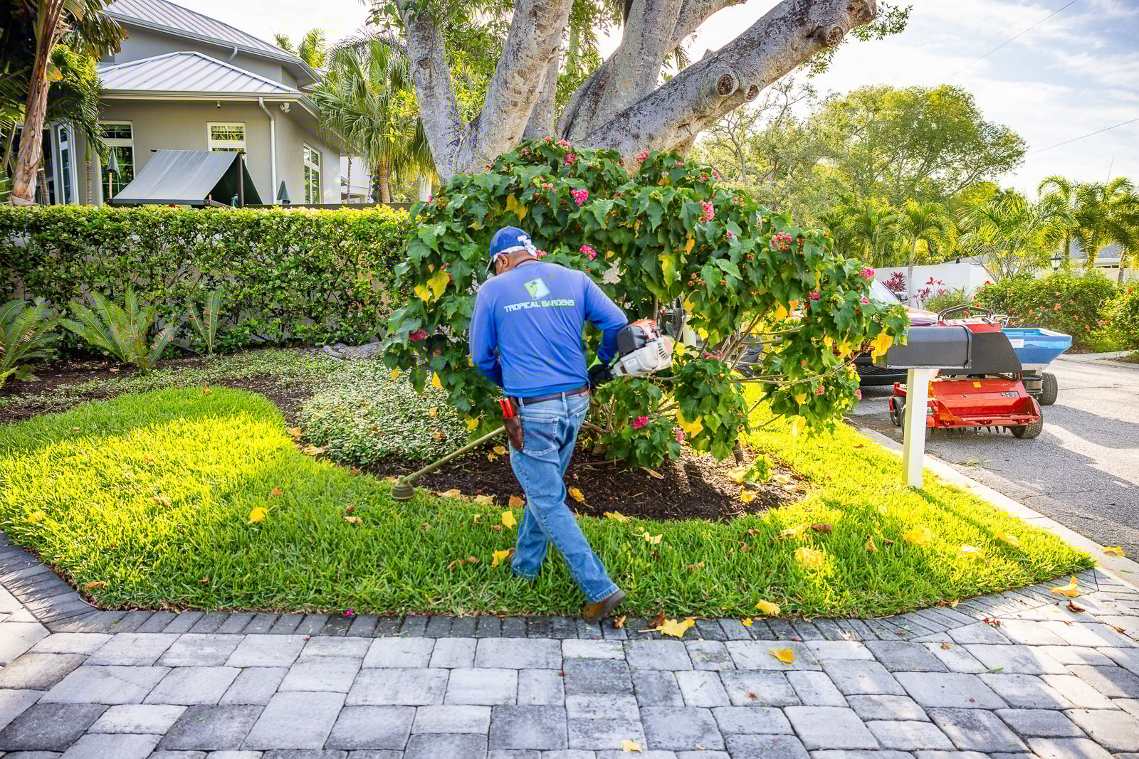 landscape maintenance crew edging in yard