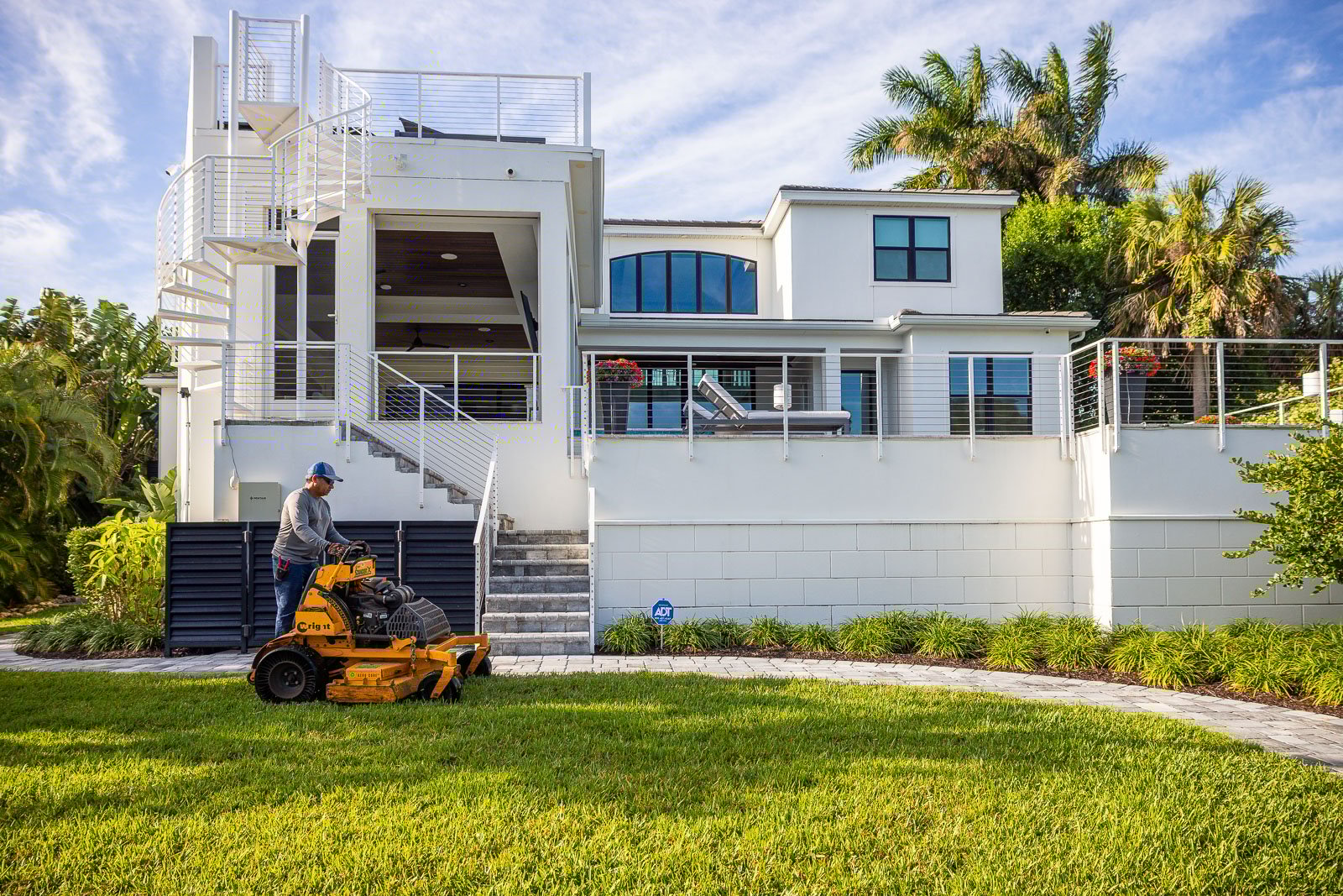 landscape maintenance crew mowing in yard 3