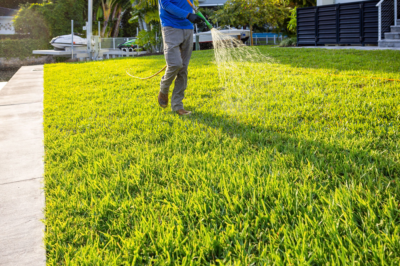 lawn care technician treating lawn 7
