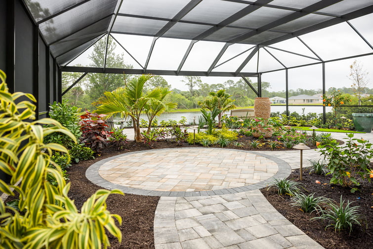 paver patio with lanai and landscape beds