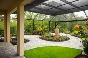 paver walkway through Lanai with artificial turf and landscape beds 8