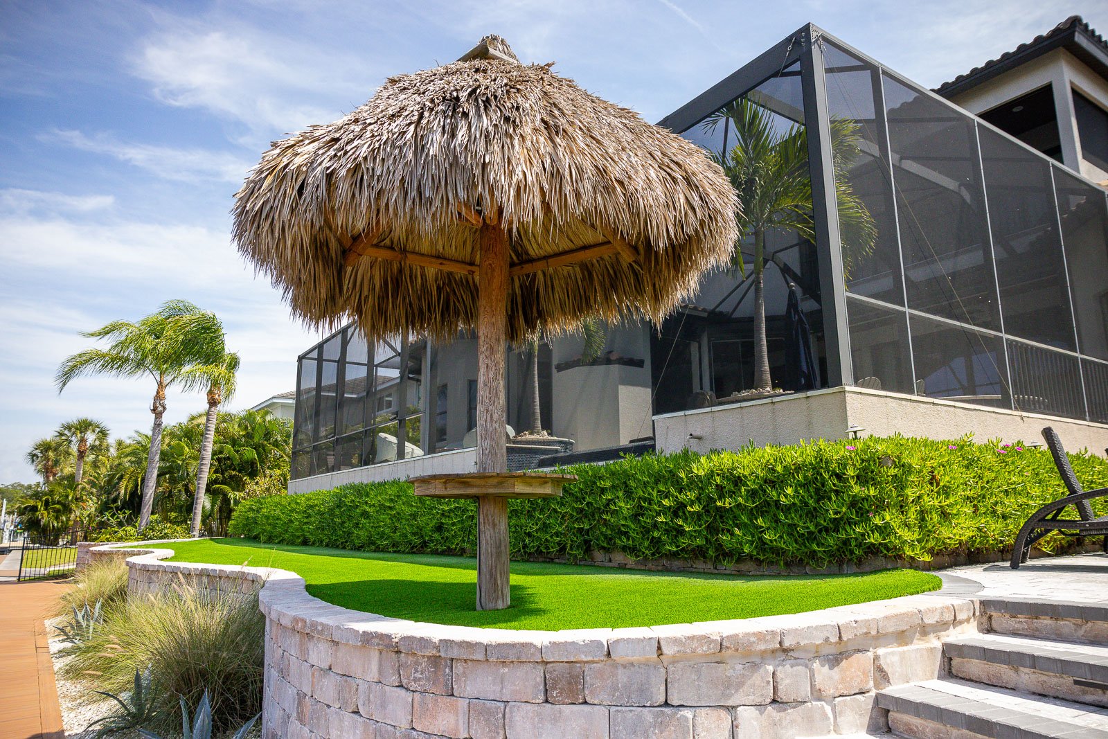 tiki umbrella backyard retaining wall and steps 