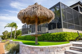 tiki umbrella backyard retaining wall and steps 