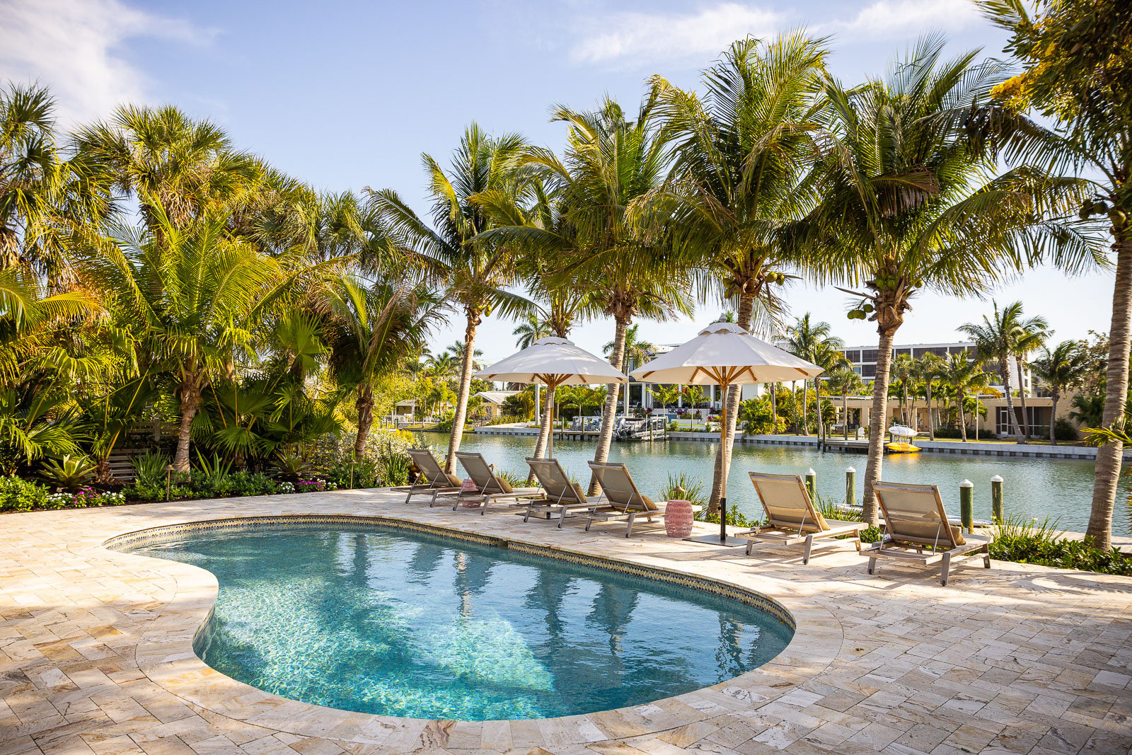 travertine pool patio with landscape beds