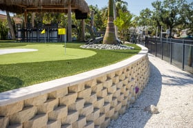 artificial turf putting green backyard retaining wall tiki hut7