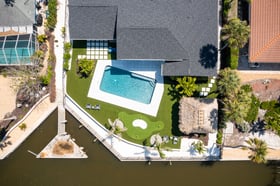 back of house aerial view landscape beds putting course pool tiki hut 2
