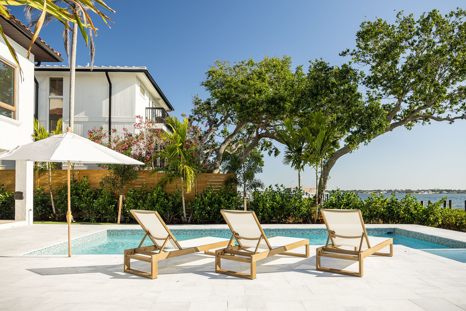 backyard patio outdoor seating pool water landscape beds