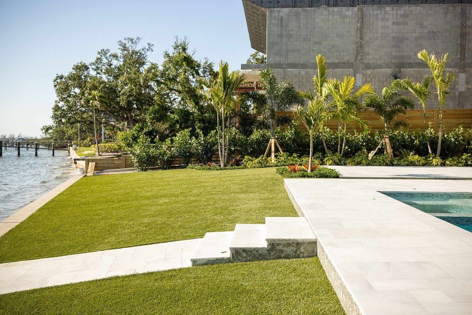 backyard patio pool landscape beds artificial turf 1