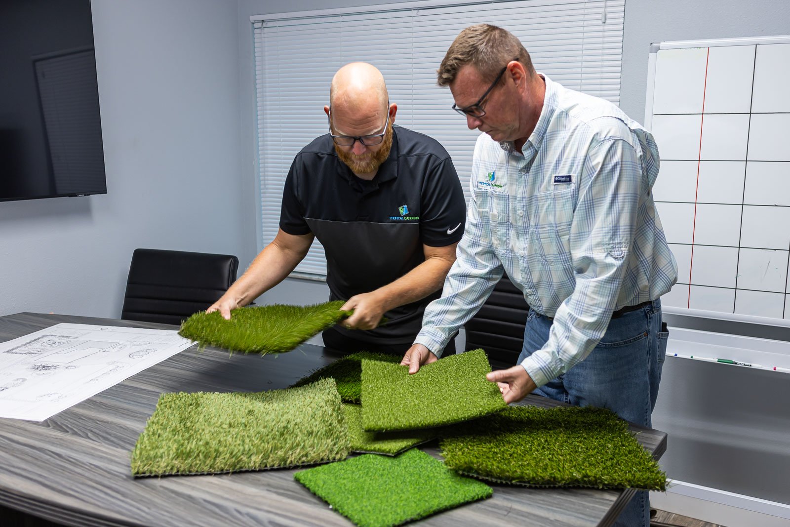 crew looking at turf samples office 1