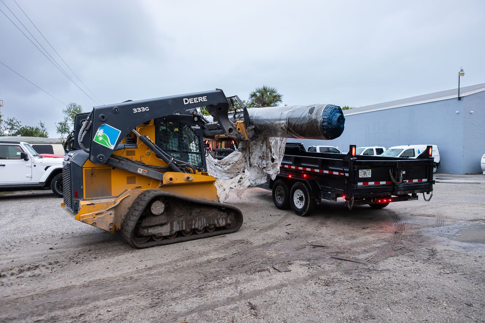 crew unloading turf from trailer 
