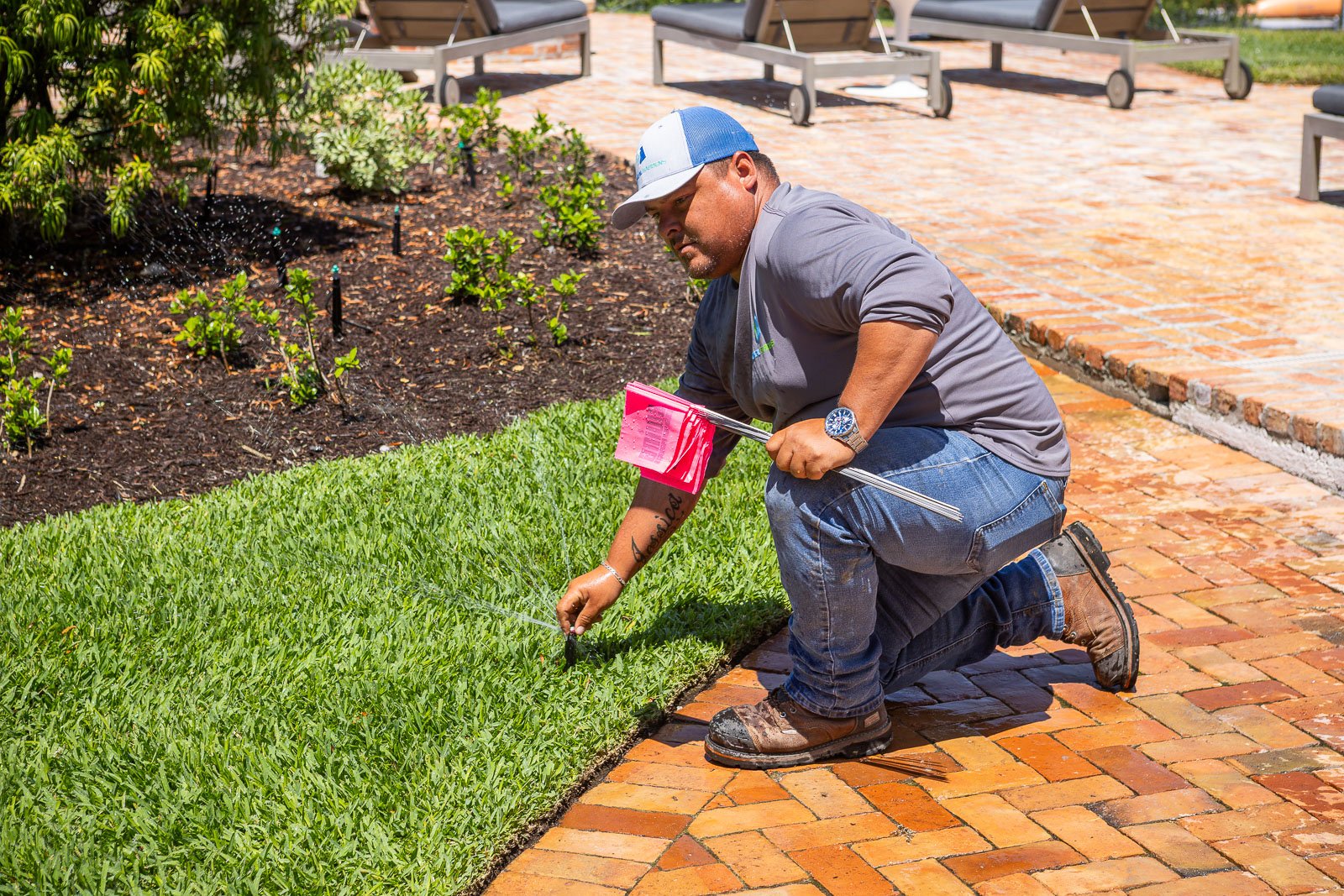 irrigtaion technician inspecting system 