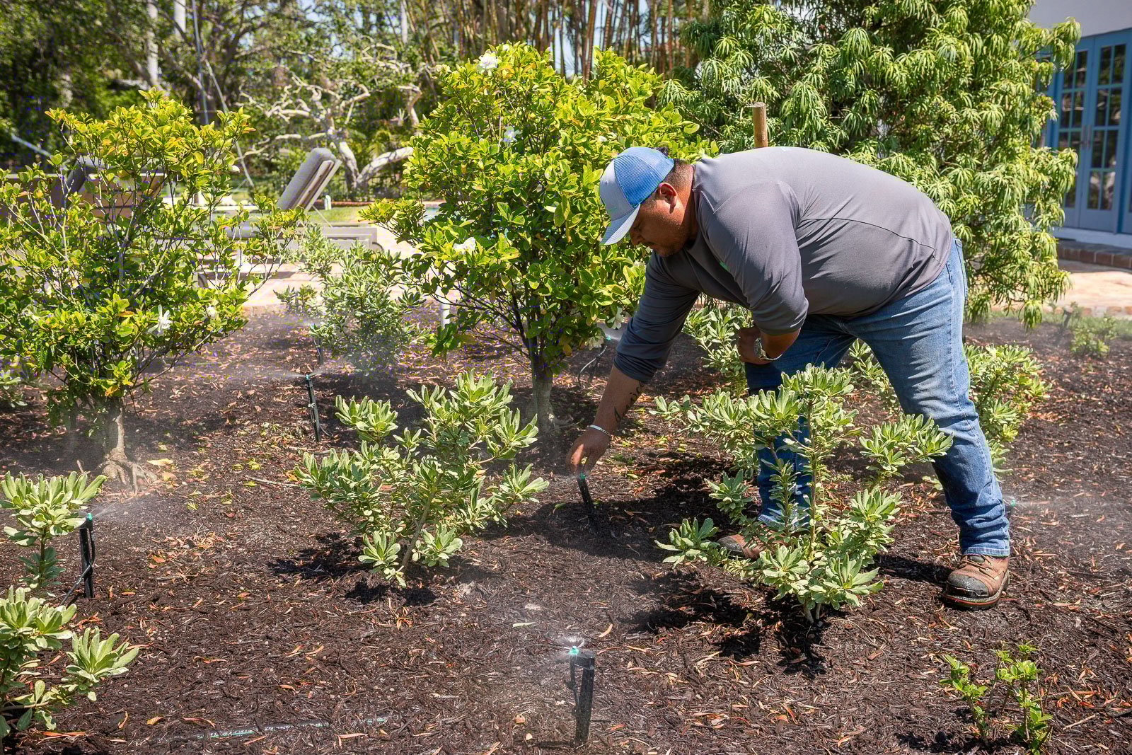 irrigtaion technician inspecting system 12