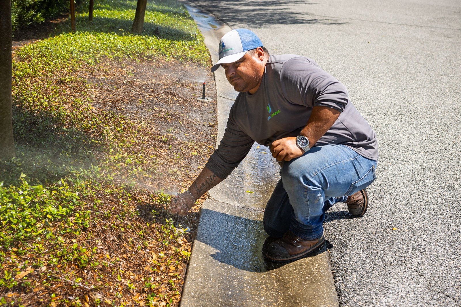 irrigtaion technician inspecting system 4-1