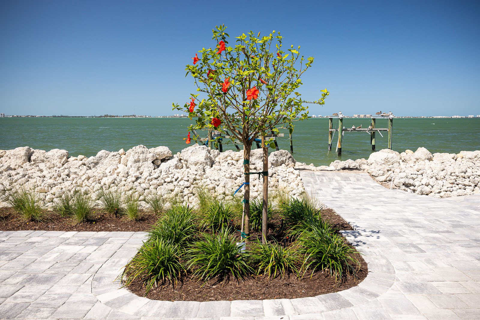 sea wall paver patio landscape bed