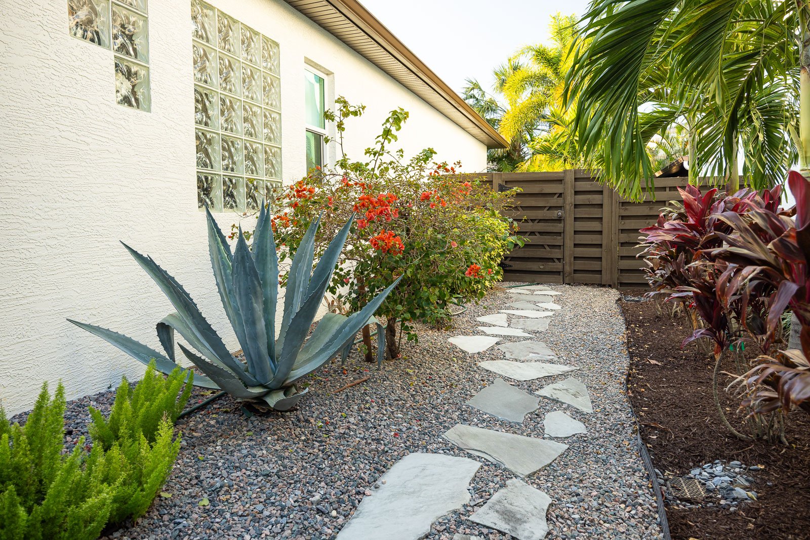 stone gravel walkway and mulch landscape bed
