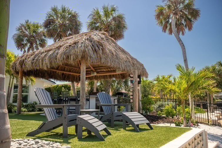 tiki hut and outdoor seating in Florida lawn