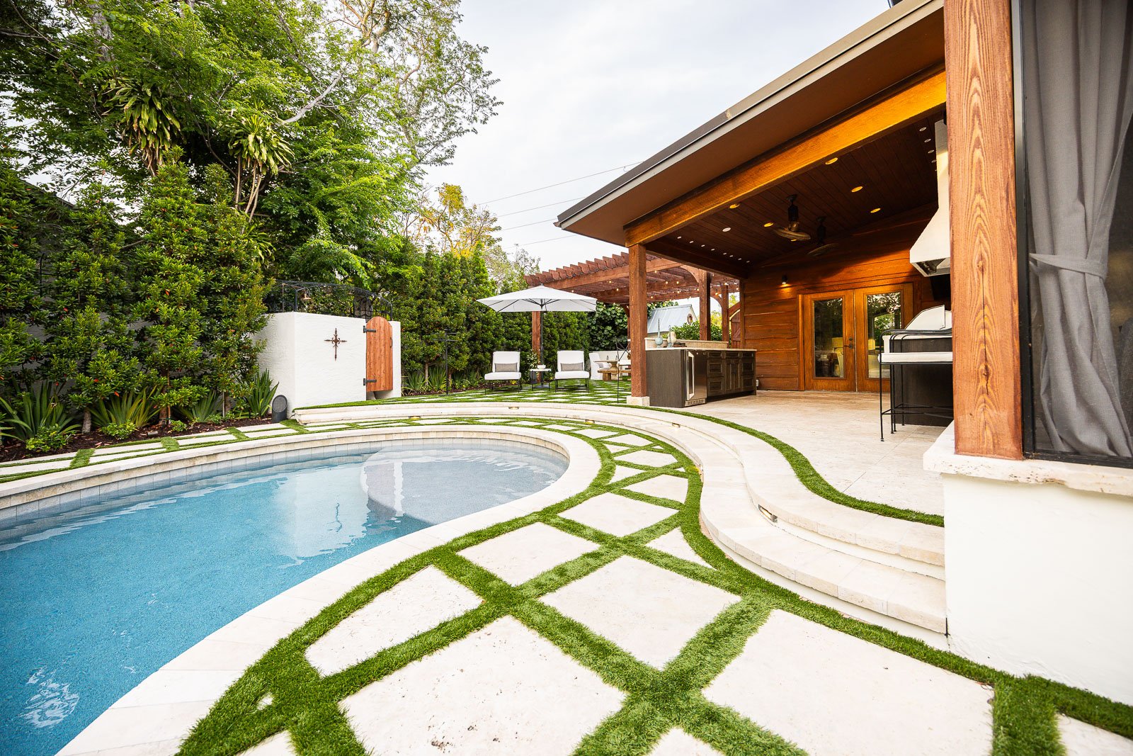 backyard pool and patio covered outdoor kicthen