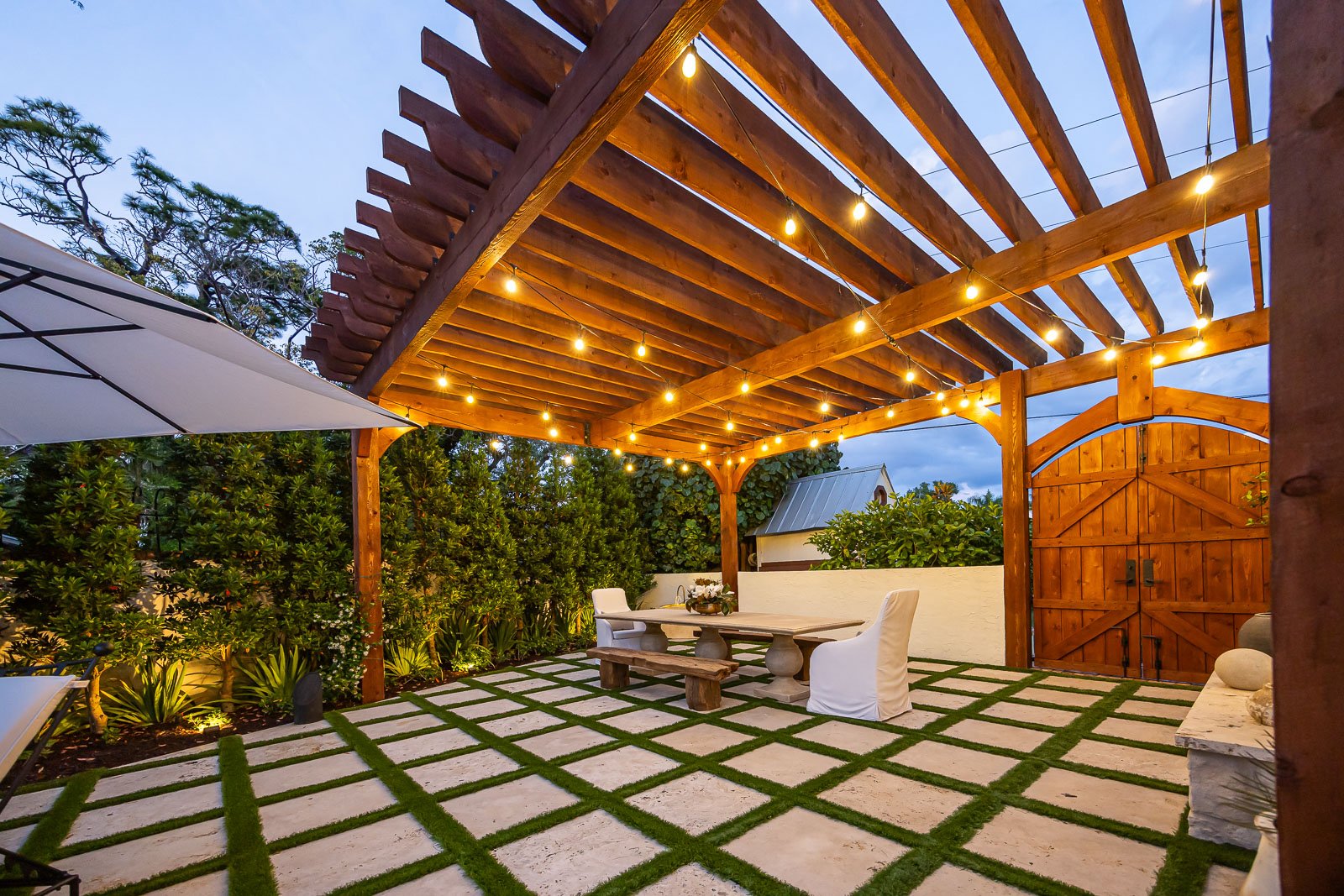 outdoor dining on patio bistro and landscape bed lighting