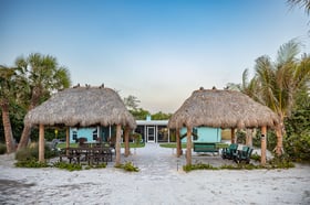 tiki huts outdoor seating paver patio and walkway