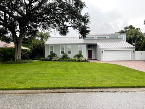 Home with green lawn and curb appeal