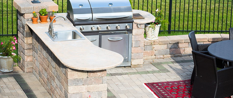 content-outdoor-kitchen-made-out-of-durable-pavers-includes-amenities