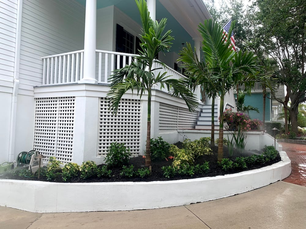 front porch with landscape beds and irrigation system