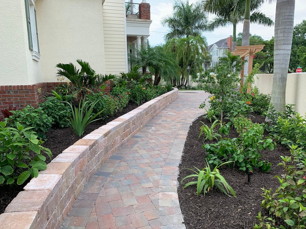 paver walkway with wall for landscape beds