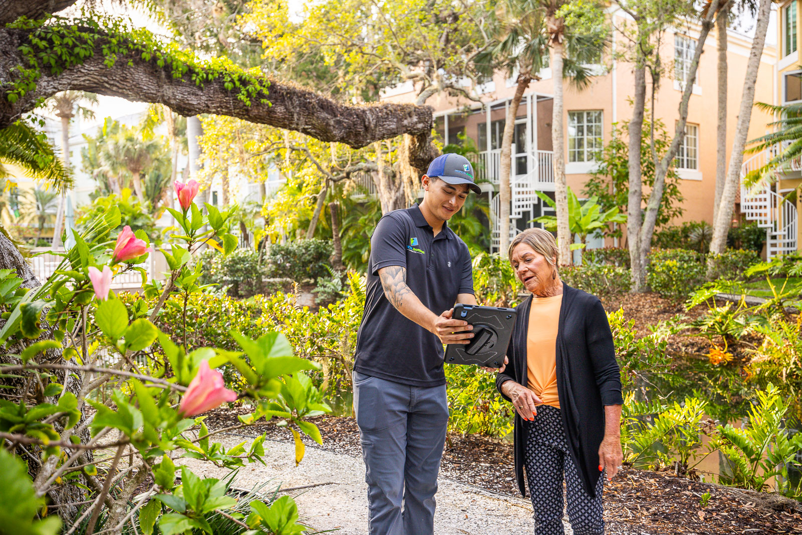 technician with hoa property manager looking at property 