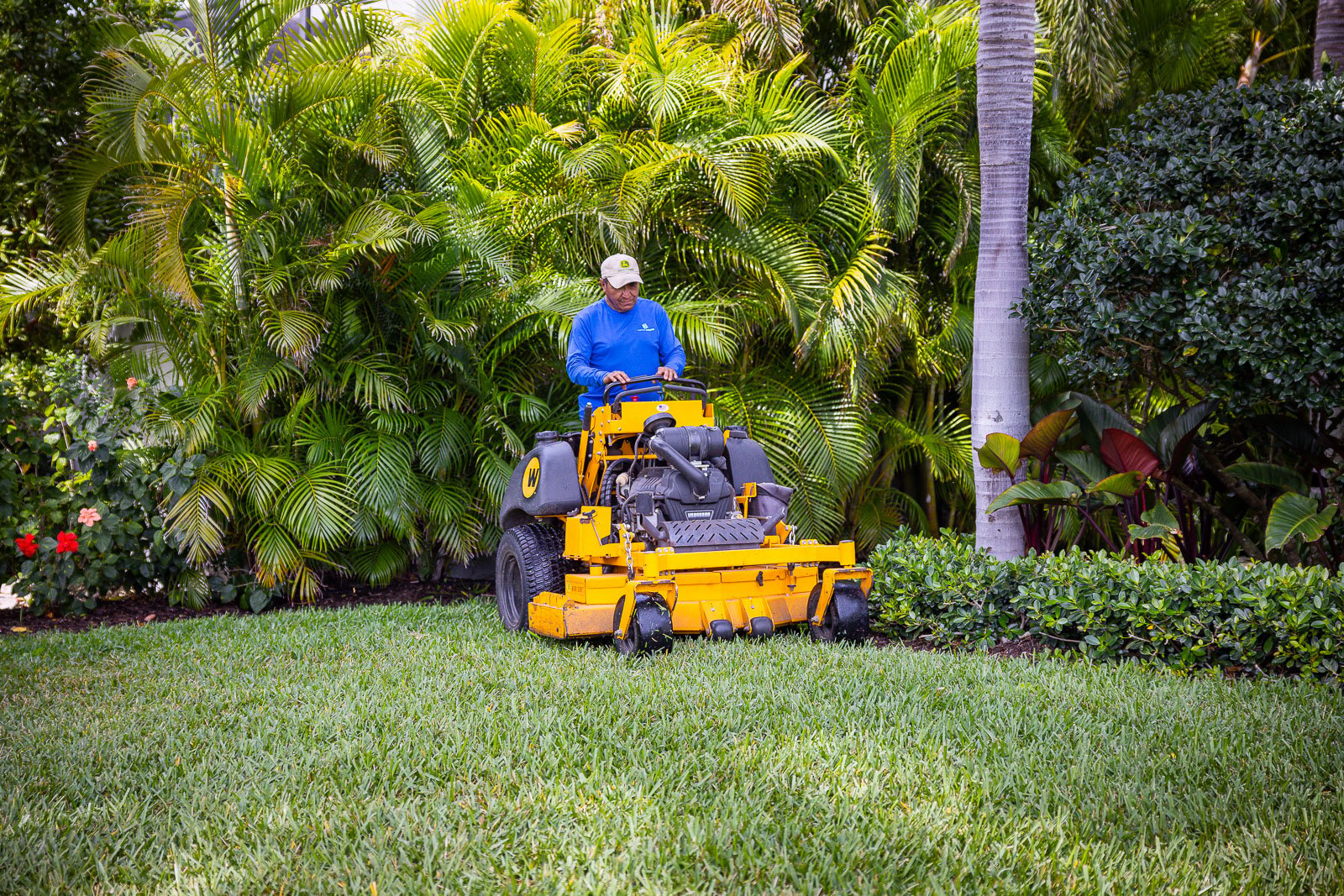 Maintenance crew mowing lawn 