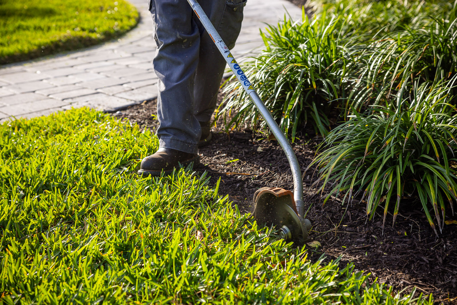 landscape maintenance crew edging in yard 2