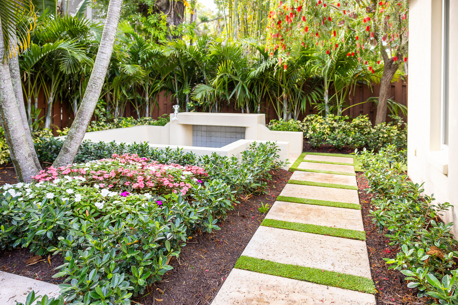 sunken garden with paver path and landscape beds