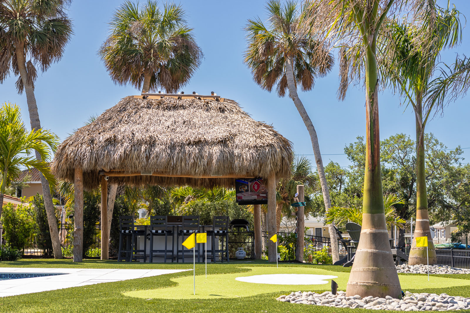 artificial turf putting green backyard retaining wall tiki hut 2