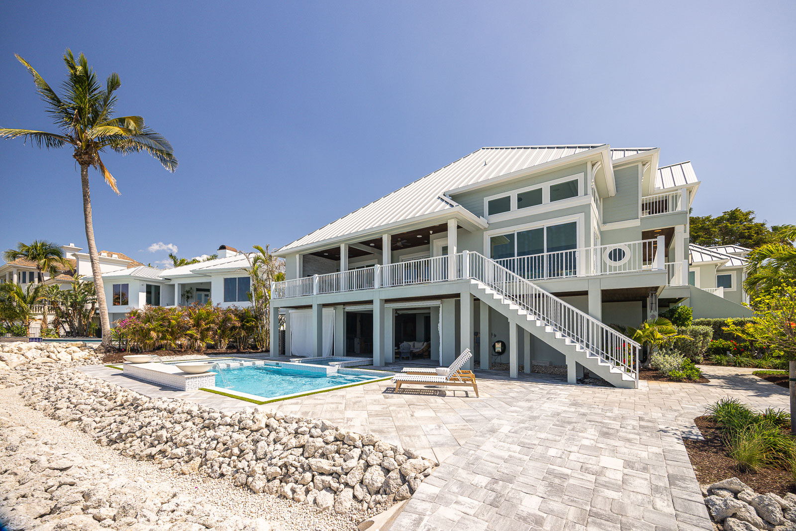 sea wall outdoor seating pool patio 2