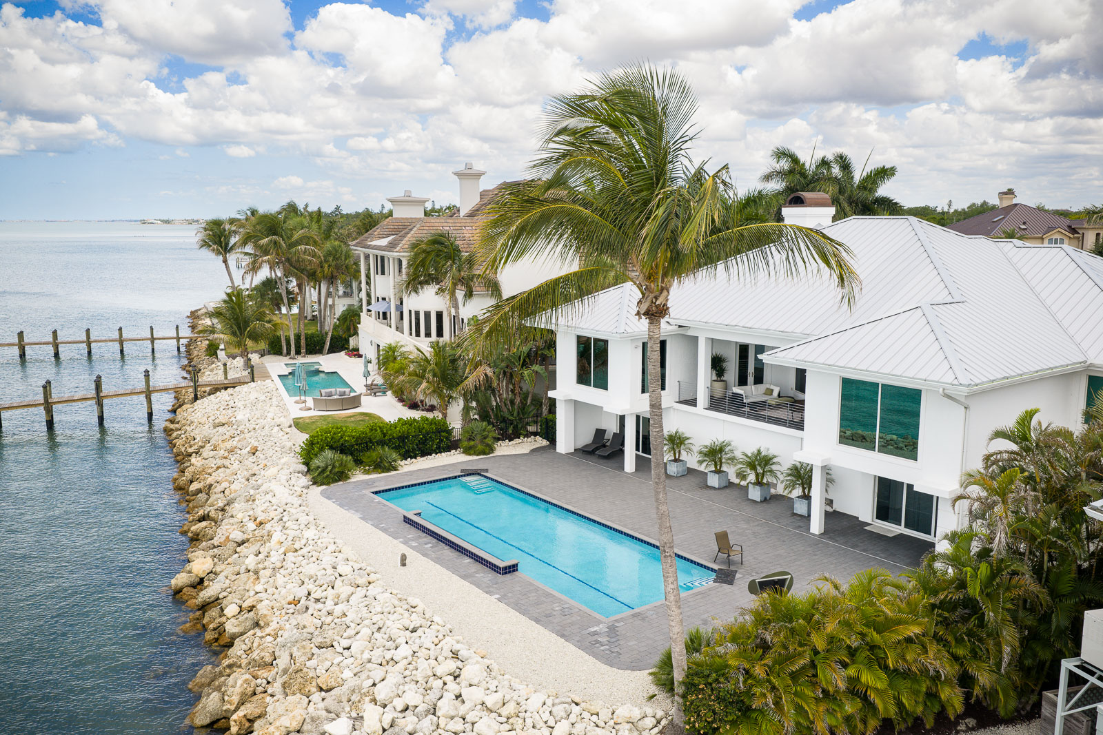 aerial view backyard pool paver pation landscape beds water