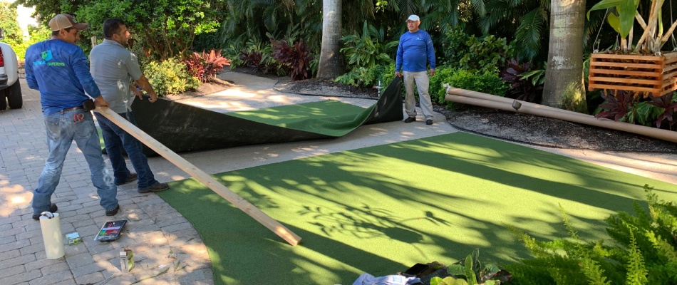 Tropical professionals installing new artificial turf for back deck near Longboat Key, FL.