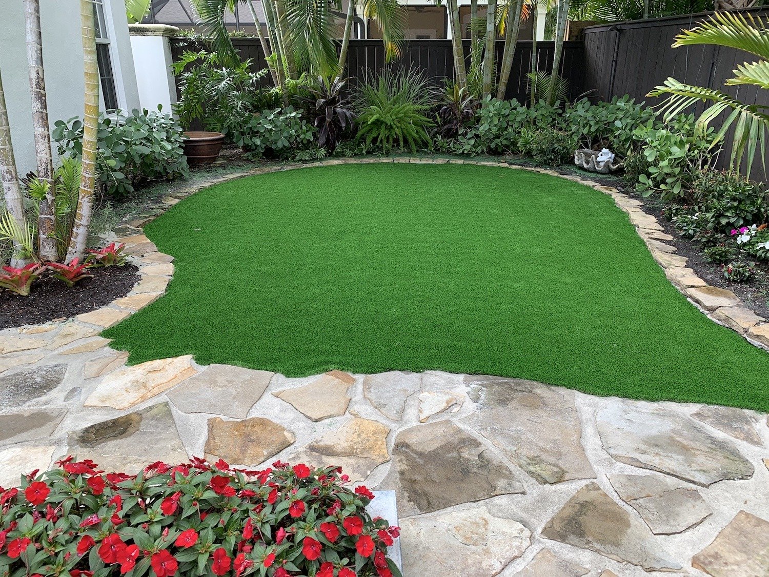 stone patio surrounding turf