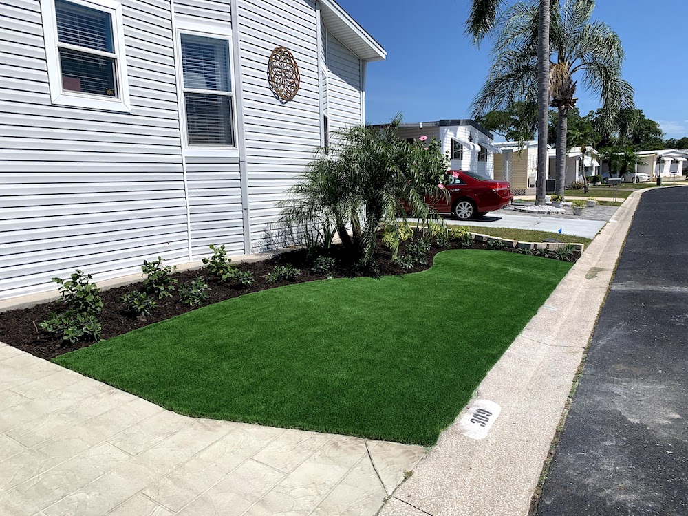 turf in front yard with planting beds